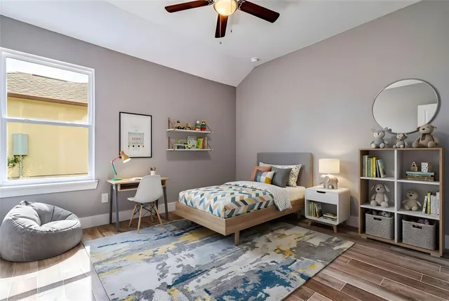 a front view of house with yard and trees in the background