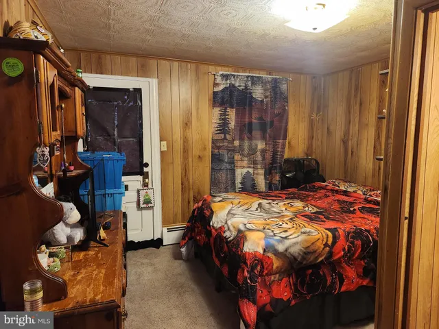 a bathroom with a sink a toilet and shower curtain