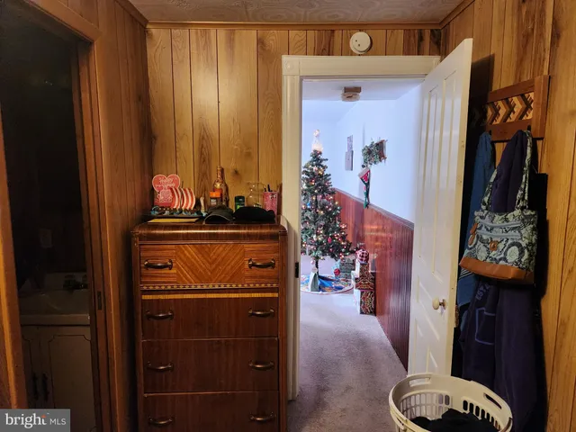 a living room with furniture a window and a chandelier