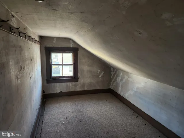 a view of an empty room with windows