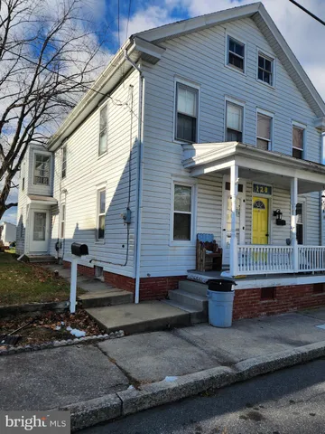 a kitchen with stainless steel appliances a stove a sink and a refrigerator