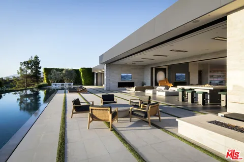 a living room with lots of furniture and a table