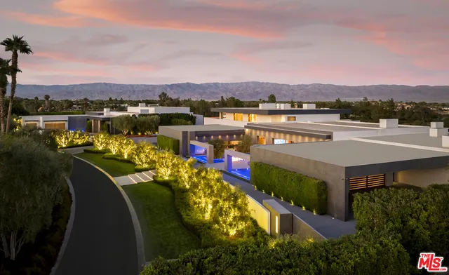 an aerial view of a house with a lake view