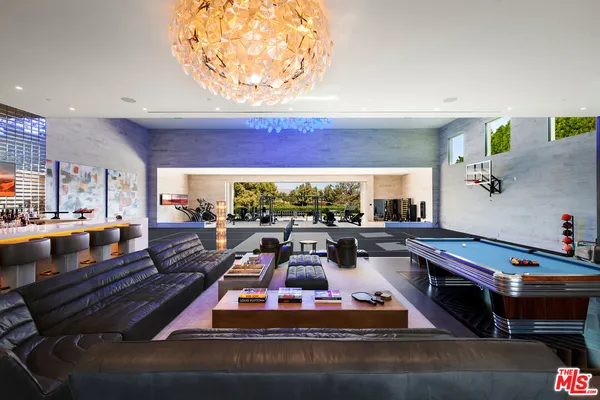 a view of swimming pool with outdoor seating