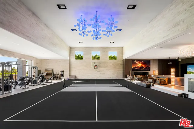 a room with gym equipment and a large window