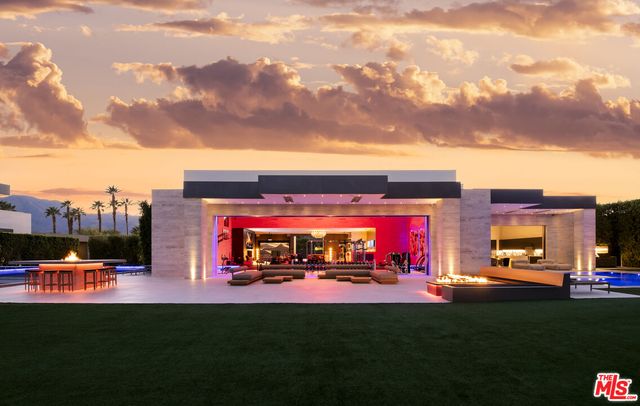 a room with pool table and windows