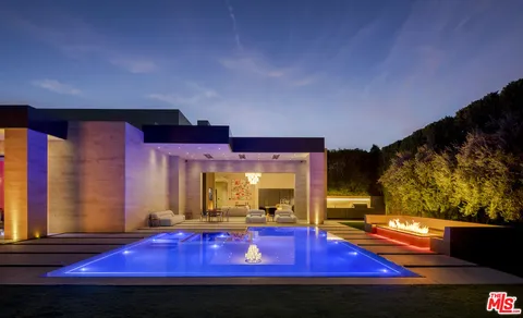 a view of a swimming pool with a yard