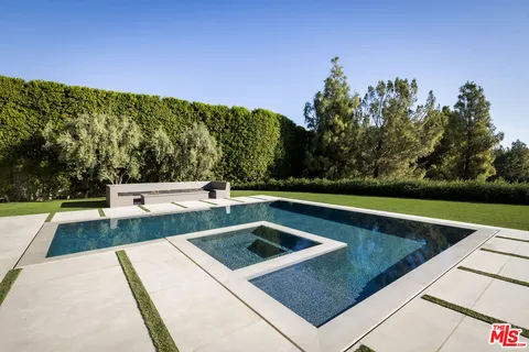 a view of a lake with a floor to ceiling window