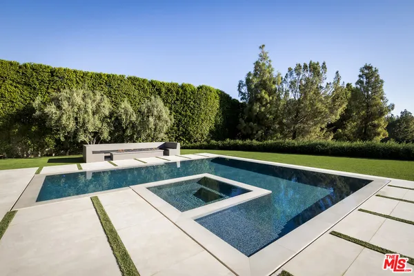 a view of a lake with a floor to ceiling window