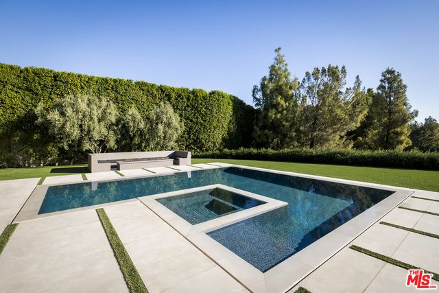 a view of a lake with a floor to ceiling window