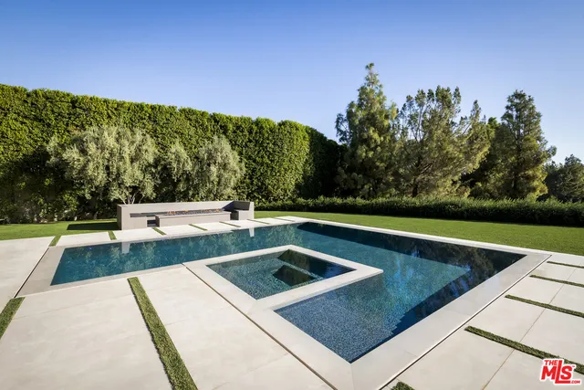 a view of a lake with a floor to ceiling window