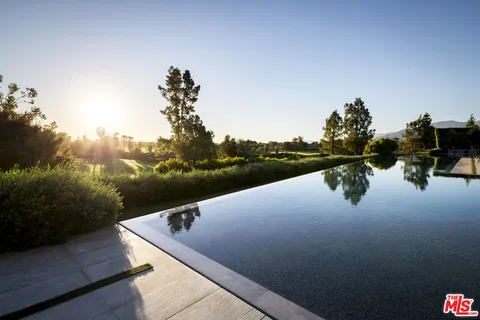 a view of a house with a big yard