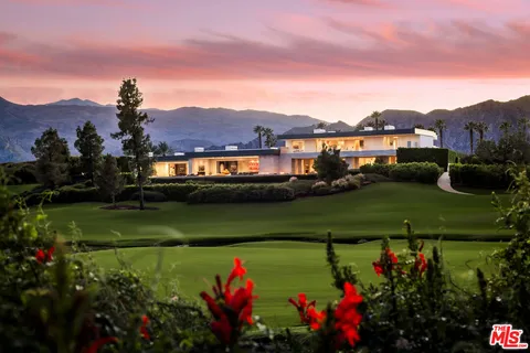 a view of a lake with a house in the background