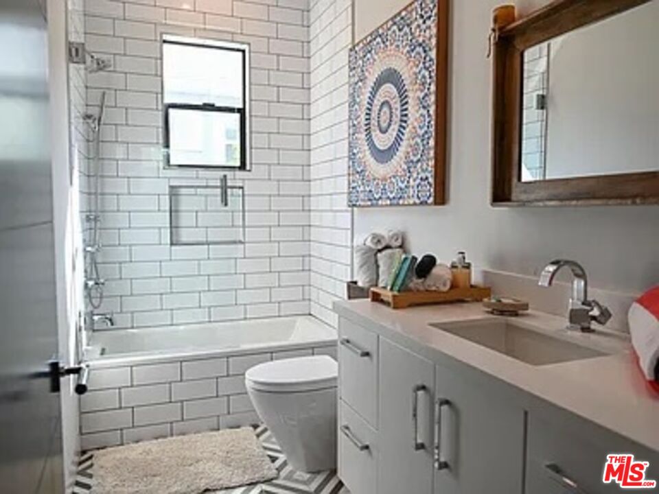 1410 Coronado Terrace Los Angeles, CA 90026 - Photo 16 of 27 a bathroom with a sink a toilet and shower