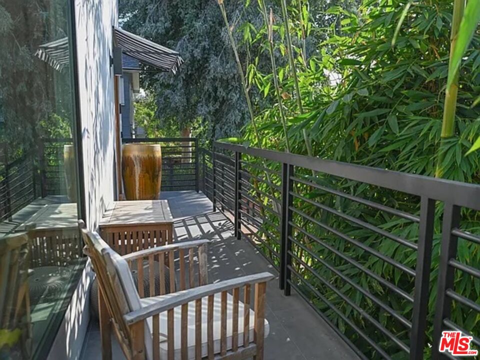1410 Coronado Terrace Los Angeles, CA 90026 - Photo 23 of 27 a view of a balcony with wooden floor