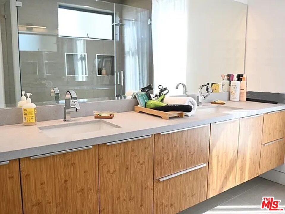 1410 Coronado Terrace Los Angeles, CA 90026 - Photo 9 of 27 a bathroom with a sink and a mirror