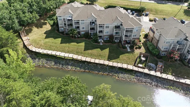 an aerial view of a house with a lake view
