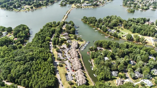 an aerial view of a houses with a lake view
