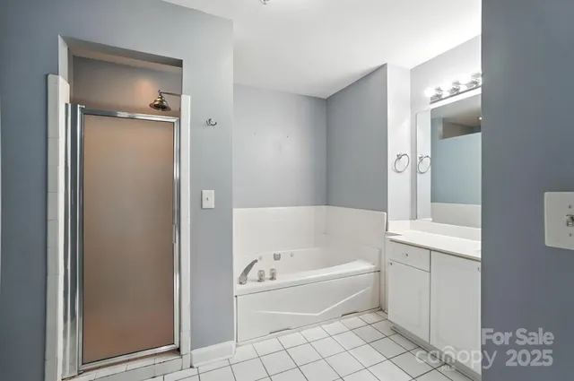 a bathroom with a bathtub and a shower
