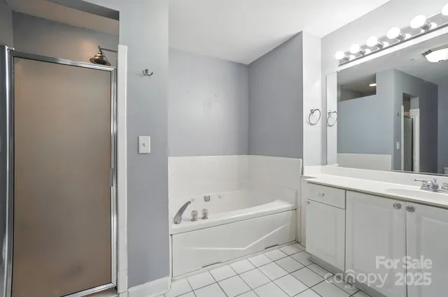 a bathroom with a tub a toilet and a sink