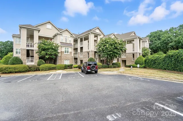 a view of multiple houses with a street
