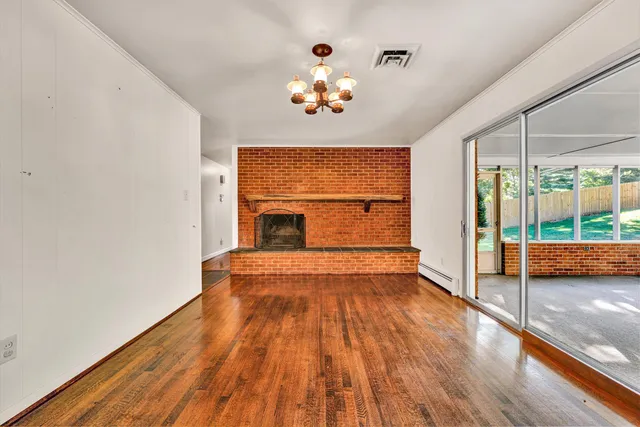 a view of fireplace and wooden floor