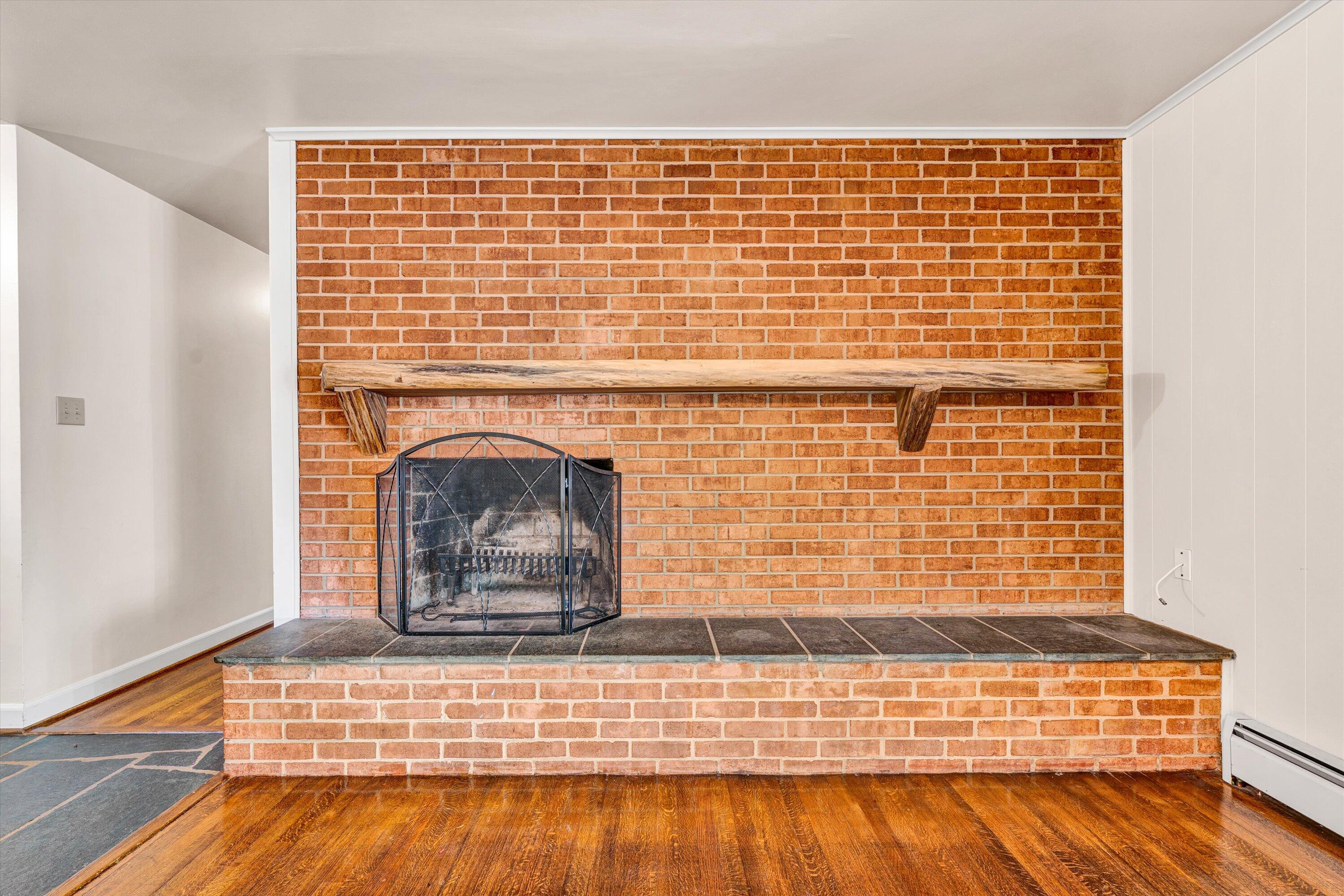 3008 Lofton Road Roanoke, VA 24018 - Photo 12 of 52 a view of fireplace and wooden floor