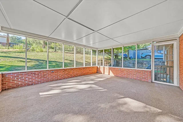 a view of an empty room with a balcony