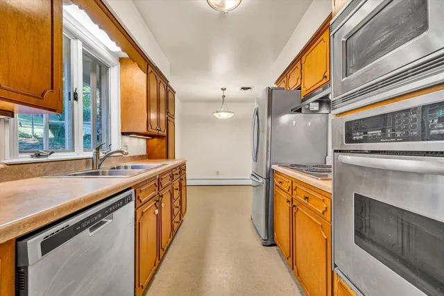 a view of a sink a counter top and door