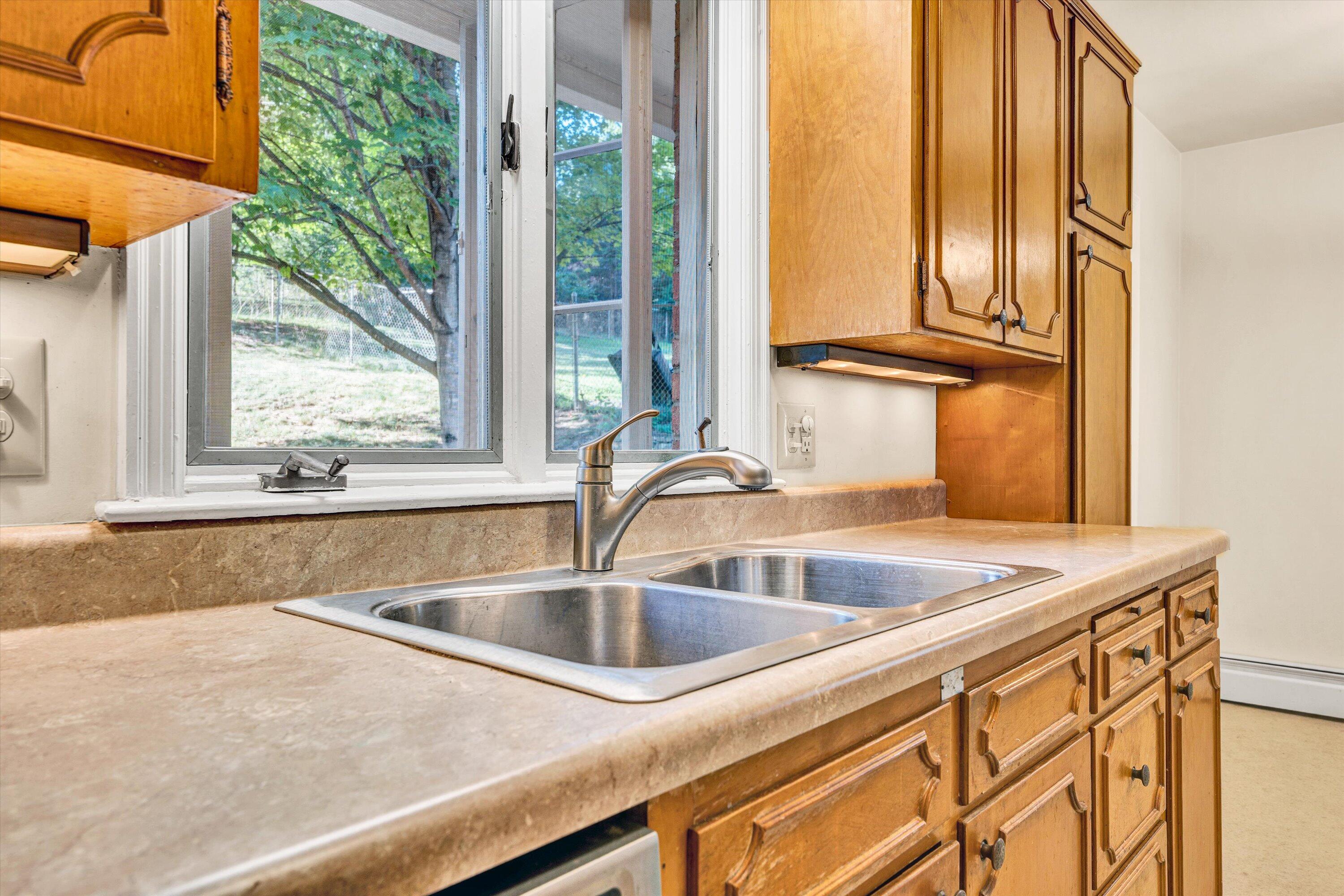 3008 Lofton Road Roanoke, VA 24018 - Photo 17 of 52 a view of a sink a counter top and door