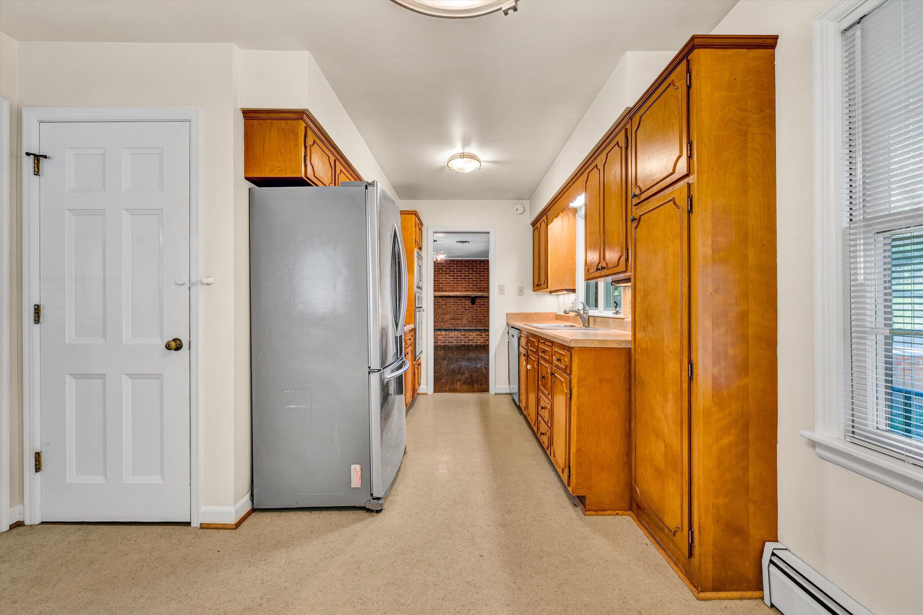 3008 Lofton Road Roanoke, VA 24018 - Photo 19 of 52 a view of a hallway with wooden shelves