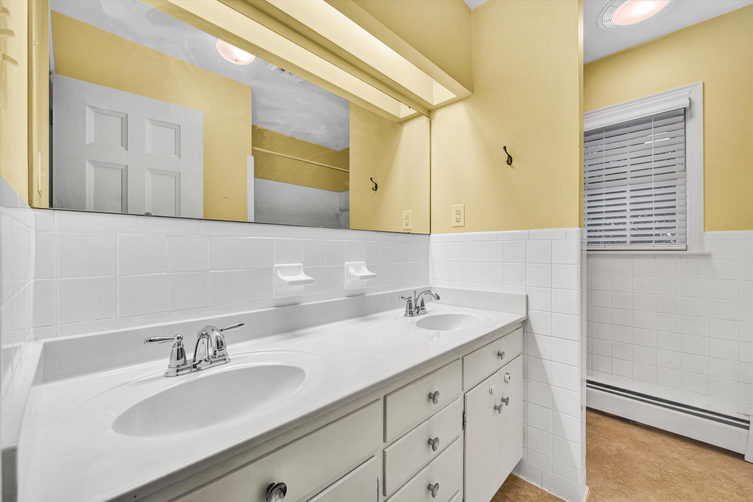 3008 Lofton Road Roanoke, VA 24018 - Photo 23 of 52 a bathroom with a sink and a mirror