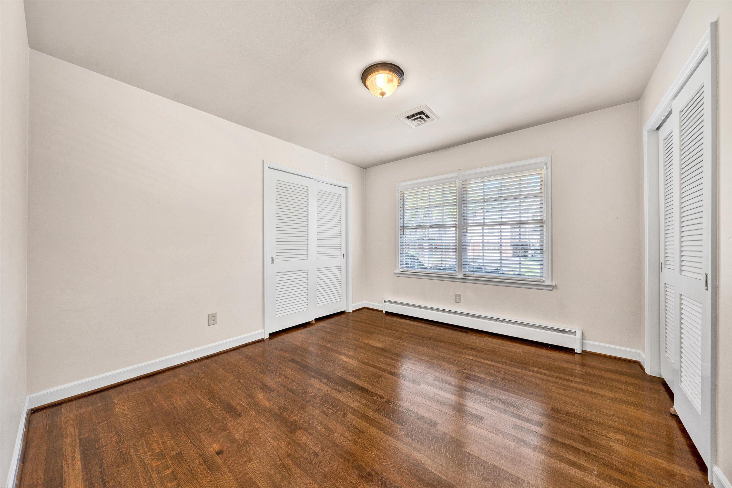 3008 Lofton Road Roanoke, VA 24018 - Photo 25 of 52 an empty room with wooden floor and windows