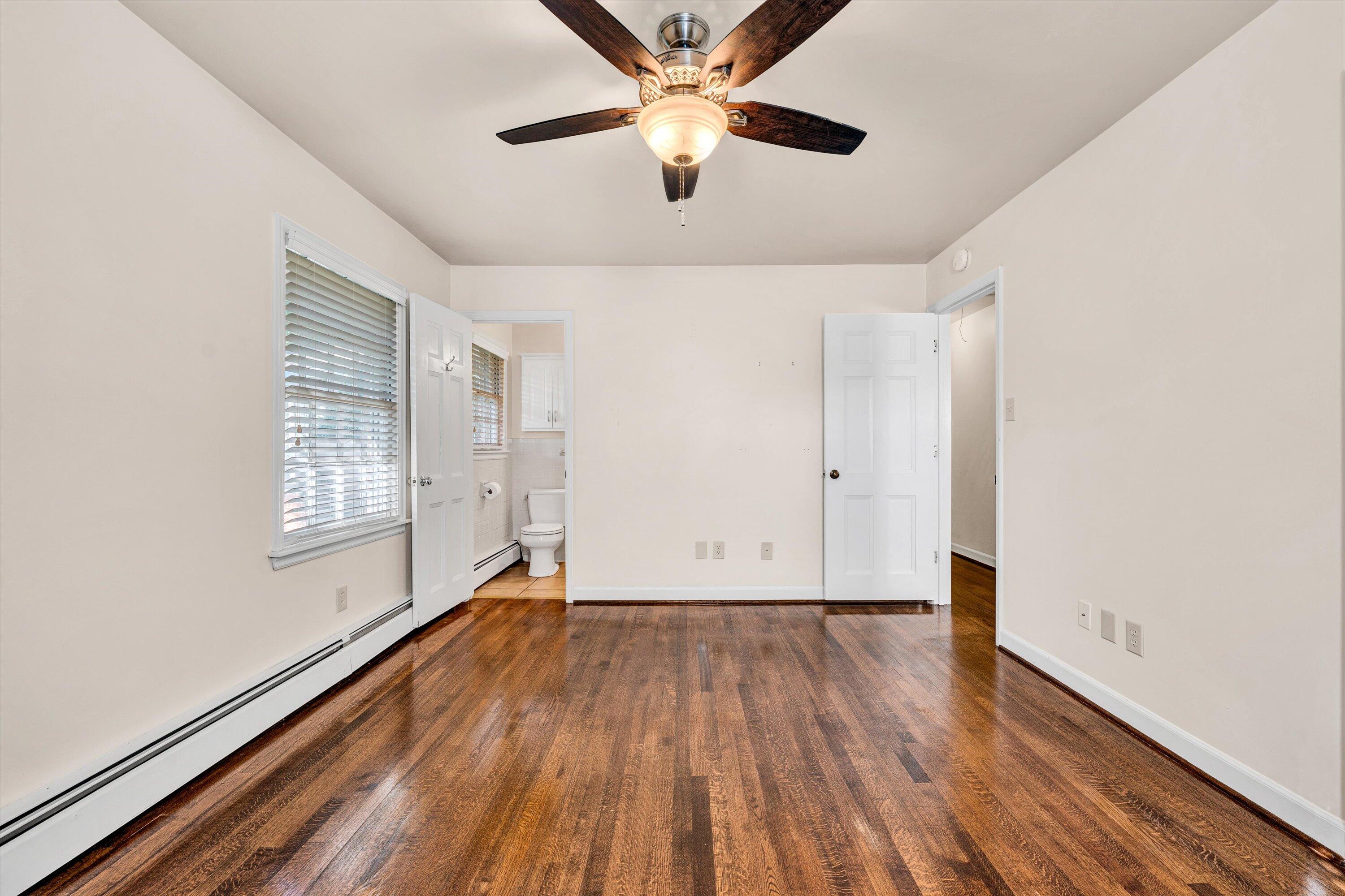 3008 Lofton Road Roanoke, VA 24018 - Photo 28 of 52 a view of empty room with wooden floor and fan