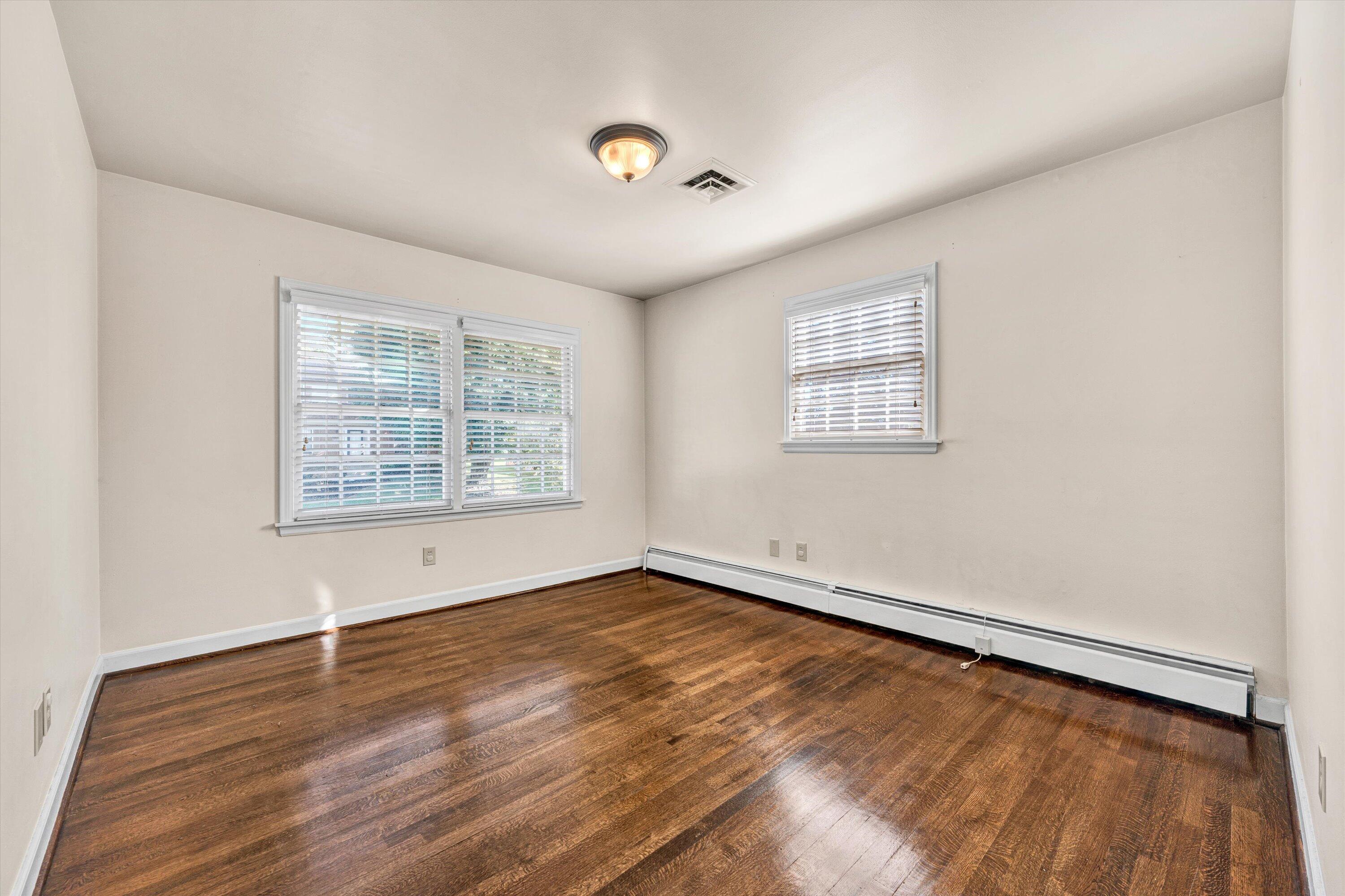 3008 Lofton Road Roanoke, VA 24018 - Photo 30 of 52 an empty room with wooden floor and windows