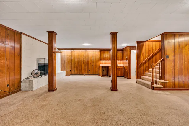 a bathroom with a sink mirror and toilet