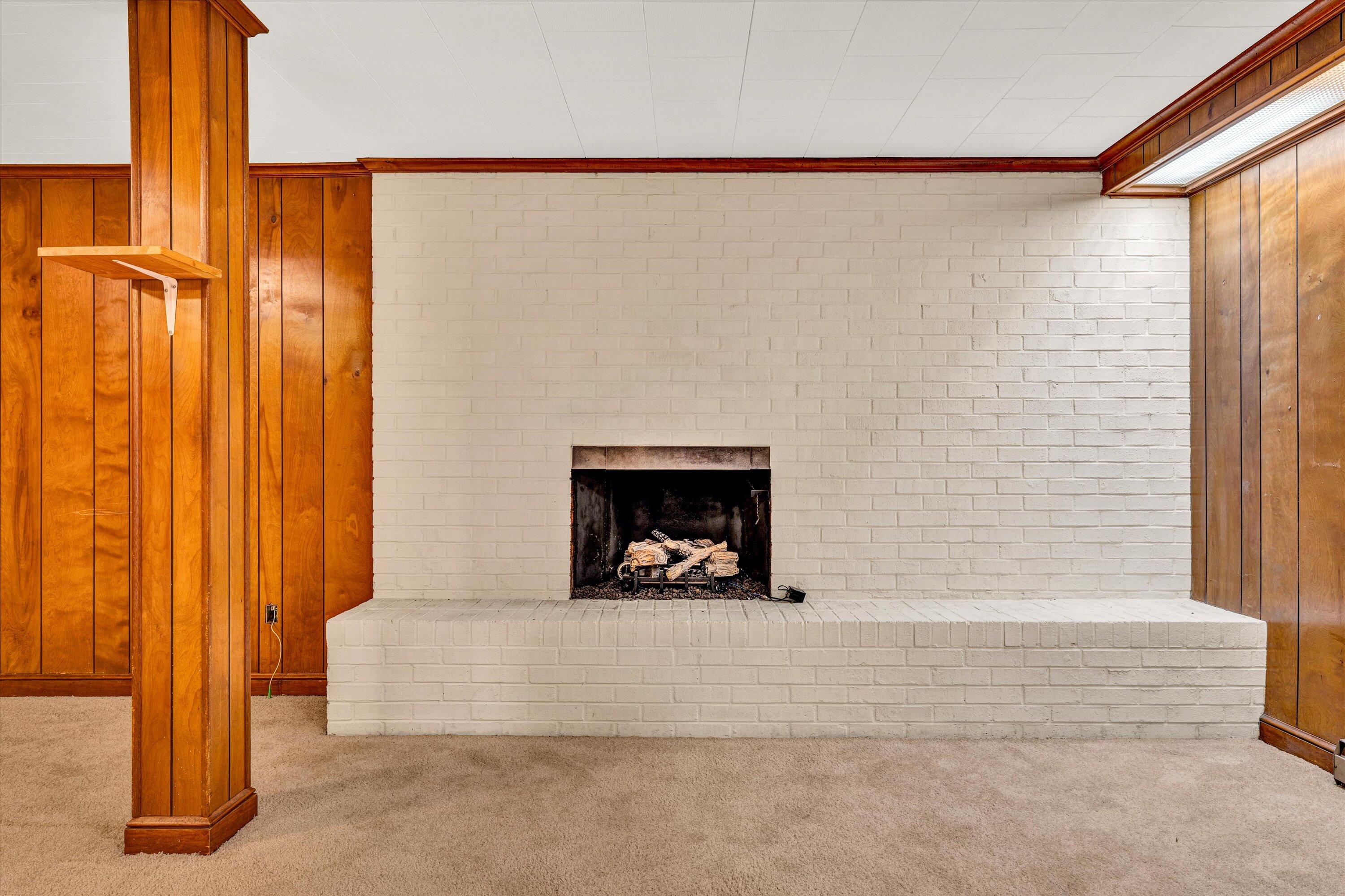 3008 Lofton Road Roanoke, VA 24018 - Photo 39 of 52 a view of a bath room with a fireplace and a window