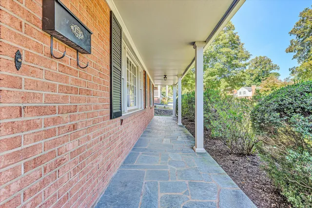 a view of a pathway both side of house