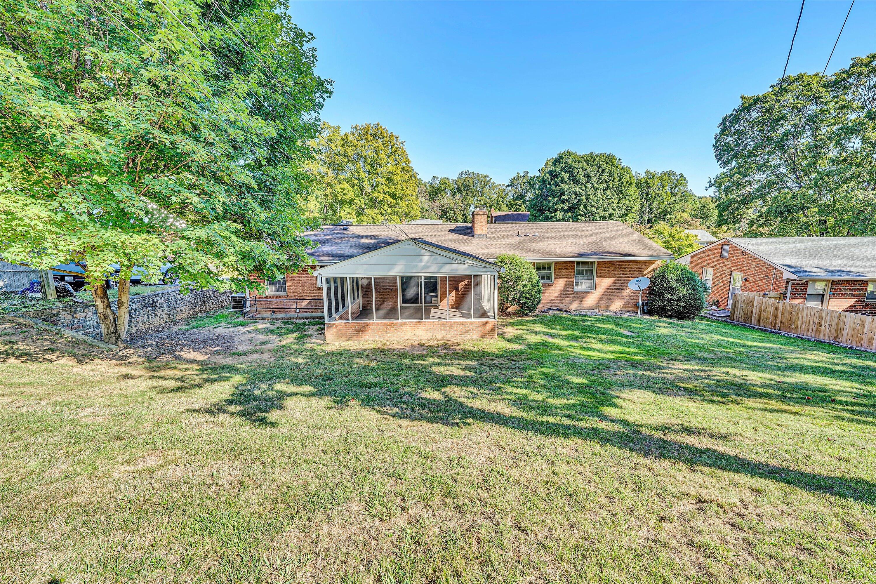 3008 Lofton Road Roanoke, VA 24018 - Photo 45 of 52 a backyard of a house with table and chairs