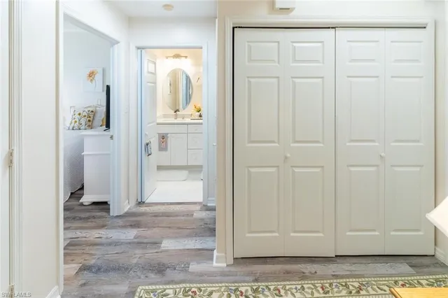 a bedroom with two beds and painting on the wall