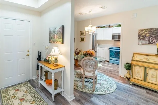 a living room with fireplace furniture and a wooden floor