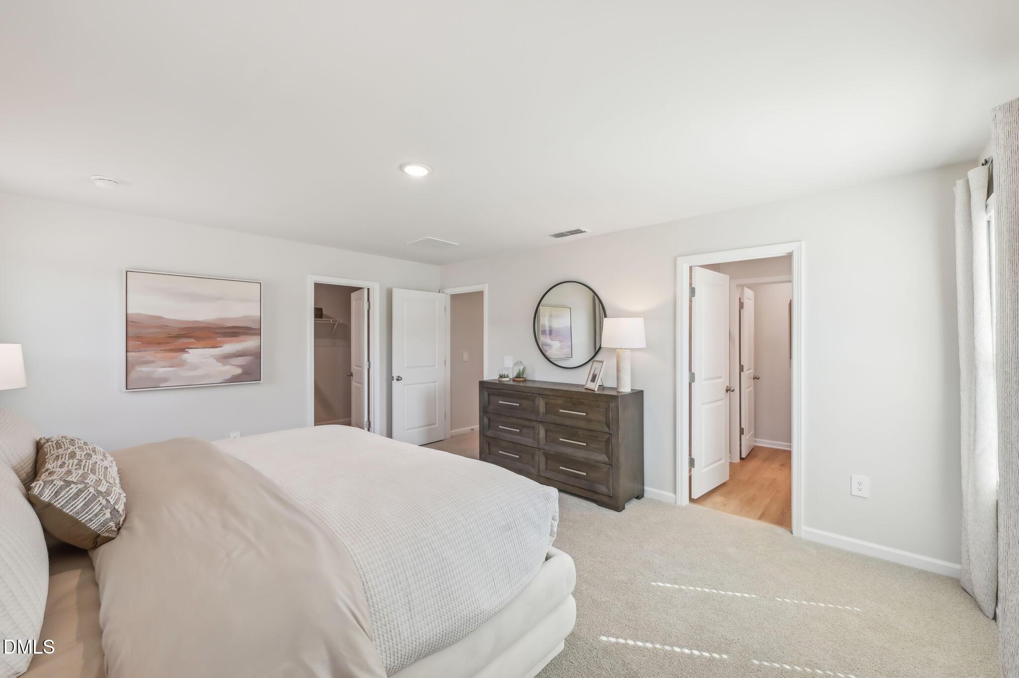 924 Broadleaf Trace Mebane, NC 27302 - Photo 14 of 26 a bedroom with a bed and dresser