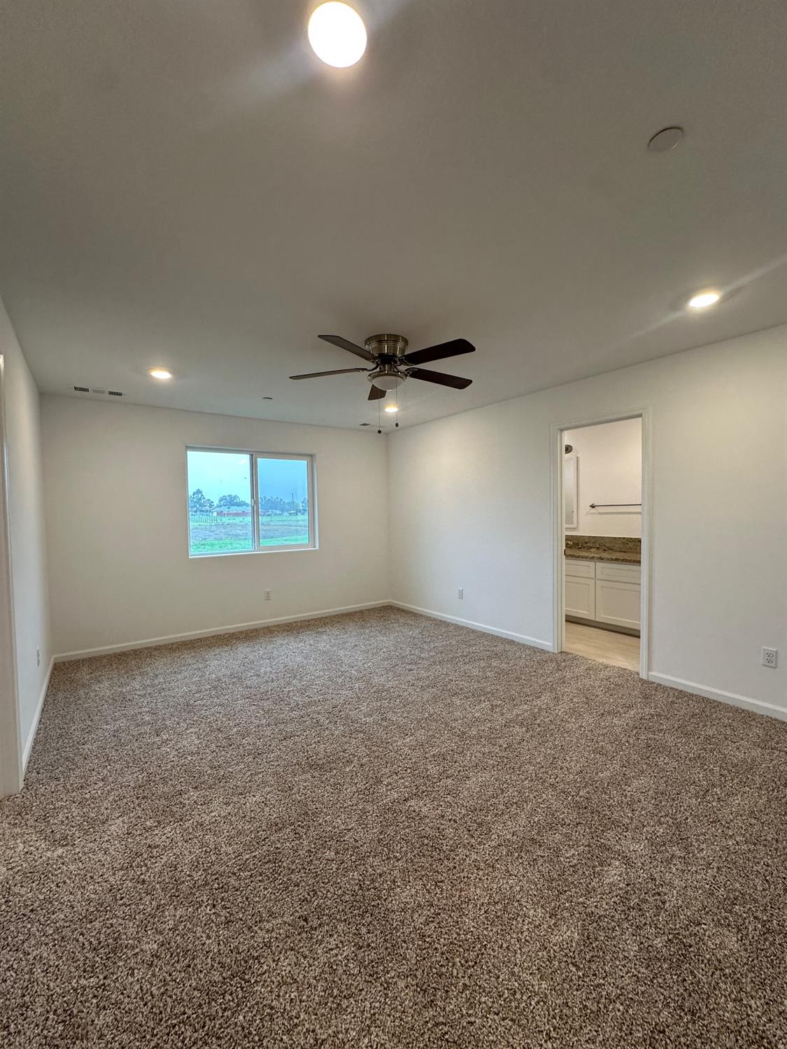 20568 Road 31 Madera, CA 93638 - Photo 14 of 24 an empty room with a empty space and windows