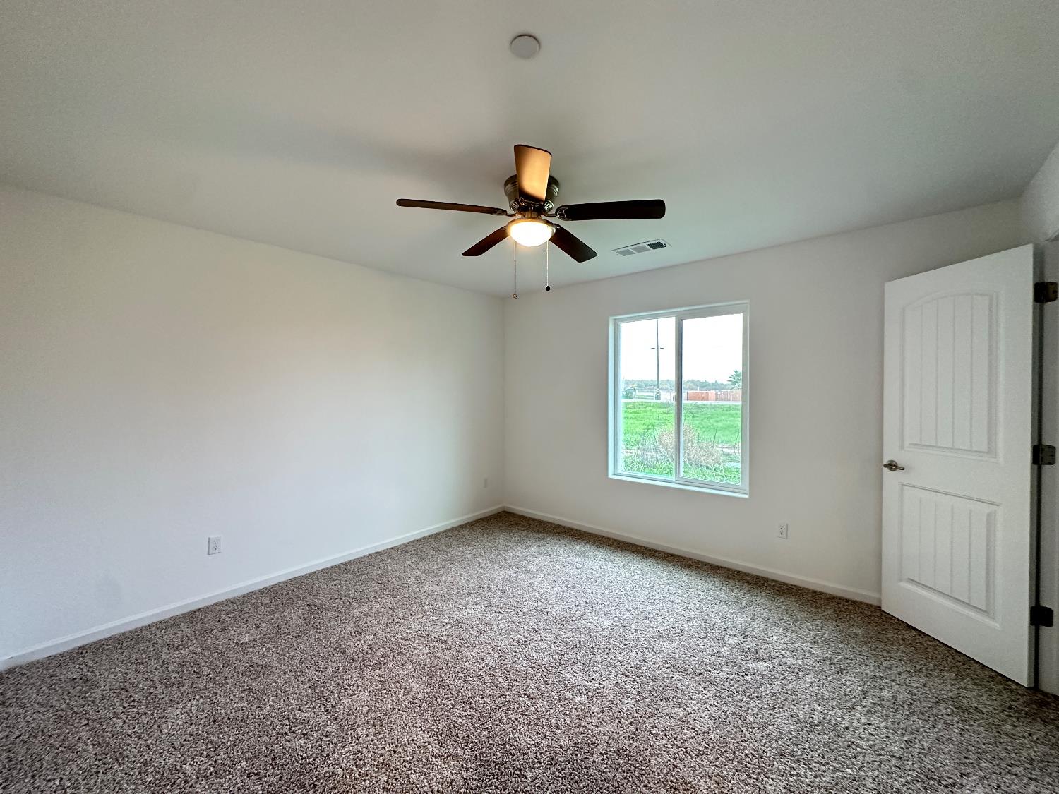 20568 Road 31 Madera, CA 93638 - Photo 16 of 24 a view of room with window and ceiling fan