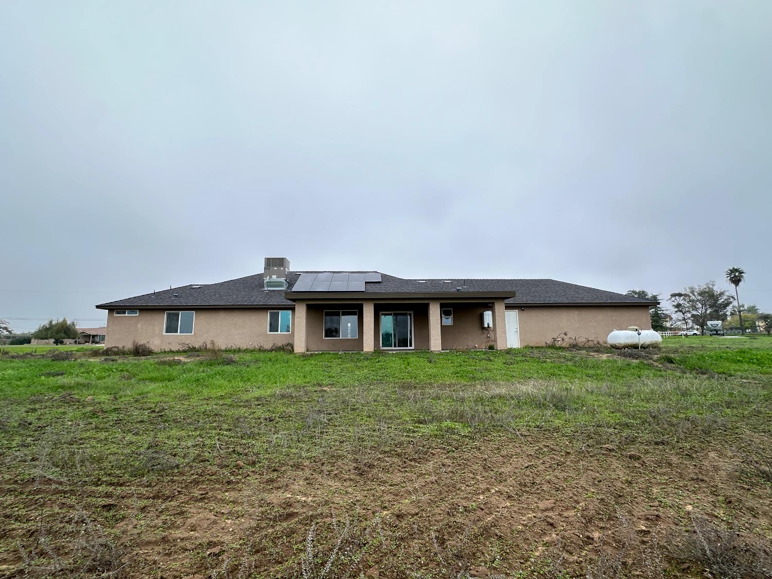 20568 Road 31 Madera, CA 93638 - Photo 24 of 24 a front view of a house with a garden