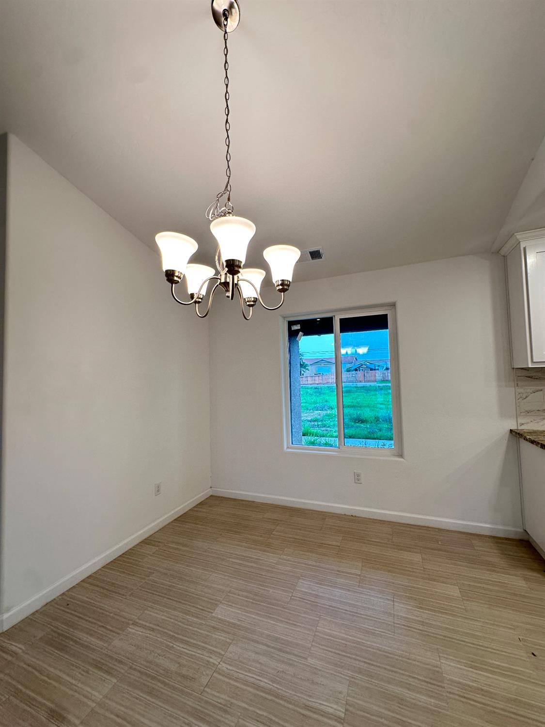 20568 Road 31 Madera, CA 93638 - Photo 9 of 24 a view of an empty room with a window