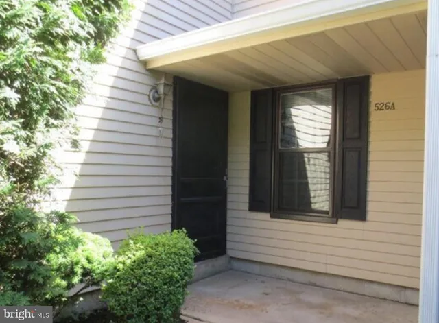 a view of a house with a and white door