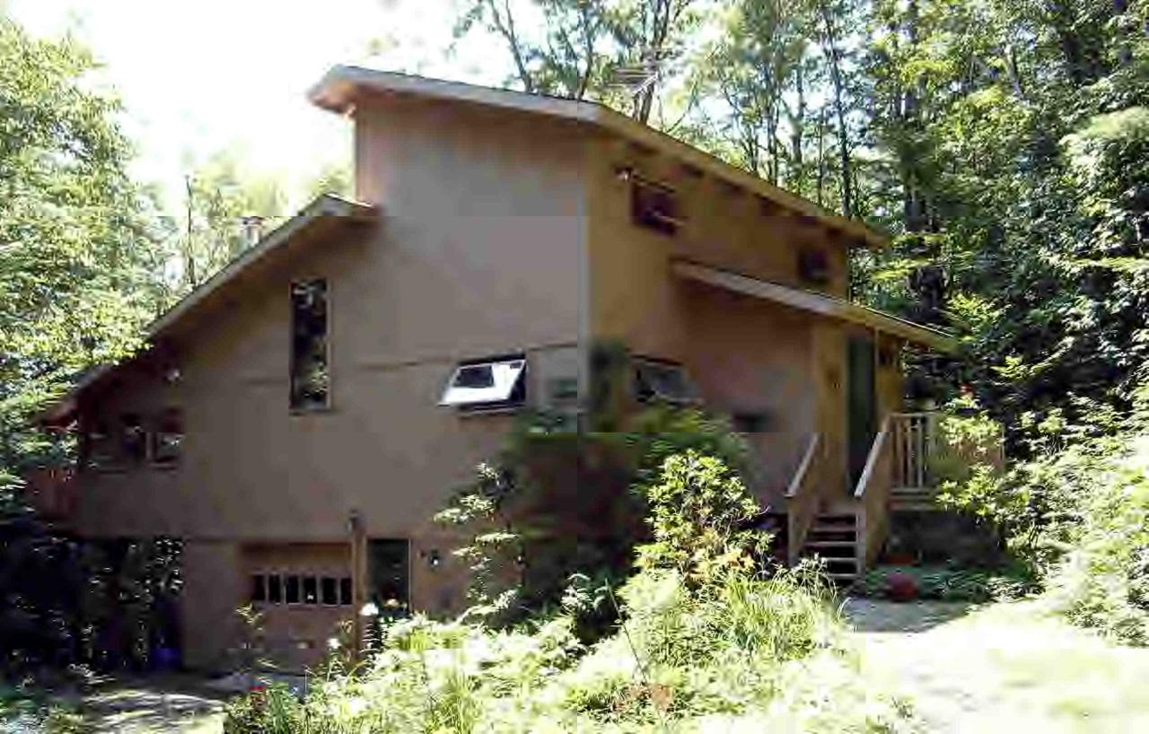 252 Fox Den Road Tolland, MA 01034 - Photo 1 of 6 a front view of a house with garden