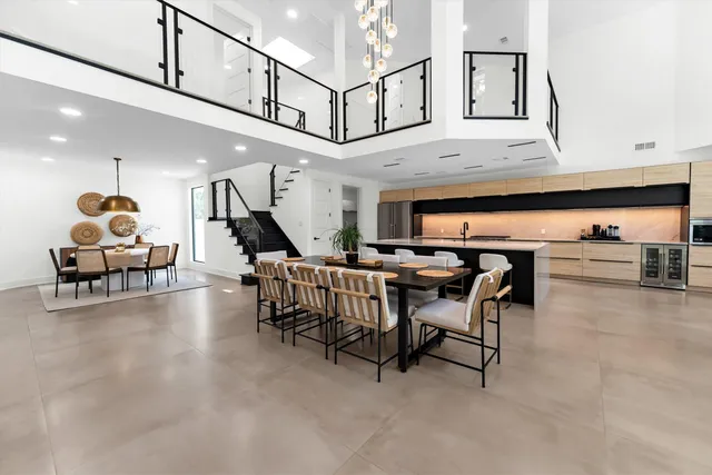 a living room with furniture and kitchen view