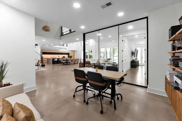 a kitchen with a table and chairs in it